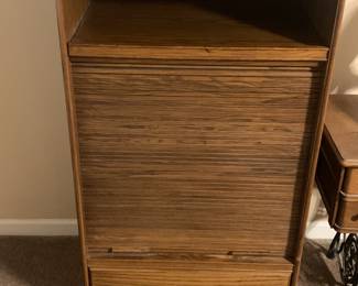 Roll down storage cabinet