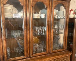 Wood china cabinet with contents of china and other dining wares 