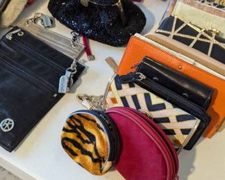 Small makeup bags and wallets, including Kate Spade