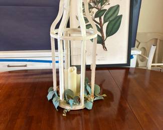 Candle in a cage.  Less messy than a bird.