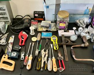 Surgical supplies.  Note the hand cranked dental drill on the right side.