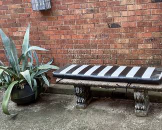 Century plant in old iron wash pot, concrete bench with custom seat pad. BENCH HAS BEEN PULLED BY THE ESTATE