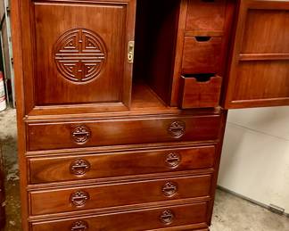 Solid rosewood chest, has desk pull out, drawers, cabinet