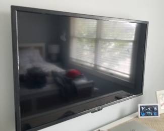 Flat screen TV with wall bracket