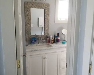Beautiful bath vanity; handsome mirror; vanity light