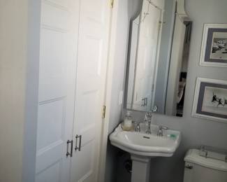 Updated interior doors; pedestal sink; stylish mirror