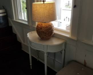 Demilune table; handsome table lamp