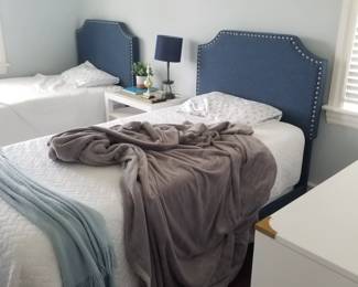 Twin beds - navy upholstered headboards
