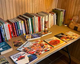 Assortment of books including cook books