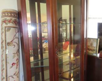 Curio with lights and mirrors.