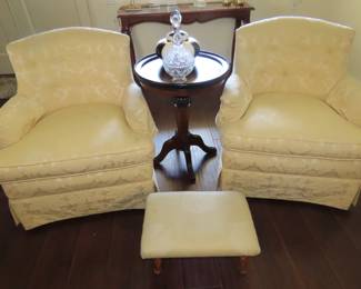 Two matching armchairs, pedestal table and small footstool.