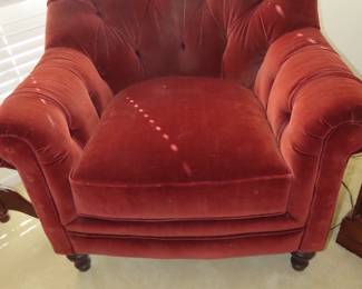Velvet deep tufted armchair.
