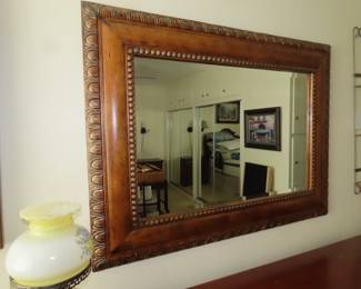 Large wood framed mirror.