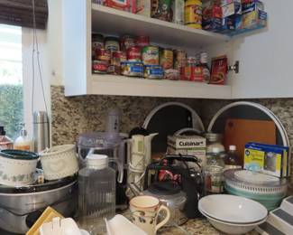 New storage shelves and lazy susans, slow cooker, food processor, electric kettle, Cuisinart chopper.