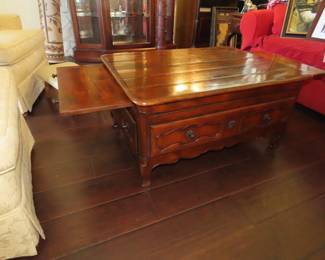 Solid wood coffee table with coctail sleves and storage drawers.
