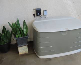 Rubbermaid storage chest, plants.