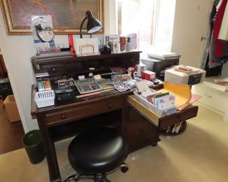 Desk with shelf, wheeled stool, office supplies,