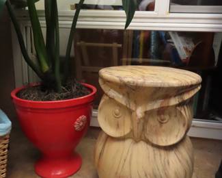 Owl themed end table, large fake plant.