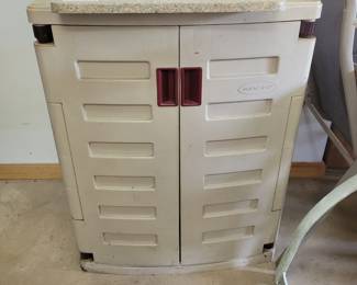 Storage cabinet with stone top.