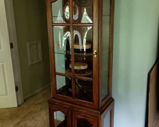 Convex glass panel  cabinet for display 
With glass shelves, adjustable 
Lighted