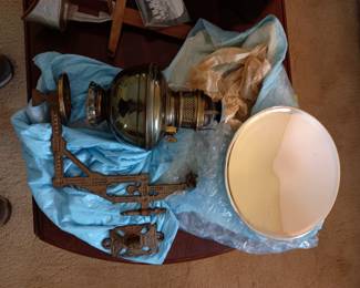 Vintage oil lamp
Wall mount holder 
Reflector, mercury glass