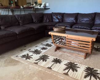 Approximately 206" long brown leather sectional 