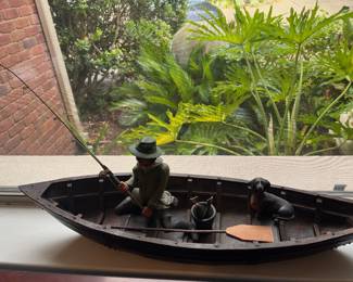 Large wooden boat with fisherman