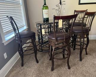 Wrought Iron Marble Top Bar with 4 swivel bar stools with leather seats. 