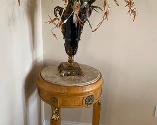 Round Egyptian style pedestal table black glass vase with bronze mask