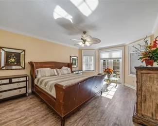 King Size Leather Sleigh bed, two matching  gray and black two toned dressers, highboy dresser