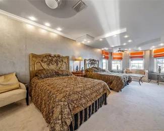 Queen Size Beds with custom coverlets and bed skirts, Guilt  carved wood  wall mounted headboards. 