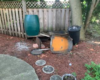 Rain barrel and wheel barrow