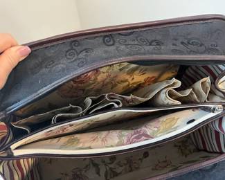 Brighton Weekender, Chocolate Leather and black paisley fabric outside with silver accents, adjustable leather shoulder strap, zippered on all 3 sides, LIKE NEW condition,  19"w x 6" d x 11" h, inside has several pockets & pouches for 3 pairs of shoes, back side has double zippered compartment to slide over pullout out suitcase handle for secure travel, rubber feet on bottom for safety & cleanliness.