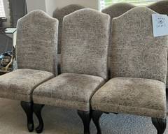 Oversized armless dining or accent chairs. upholstered taupe paisley sueded velvet, 24"w x 24"d x 43"h very high back, with espresso carved legs. Very good condition.