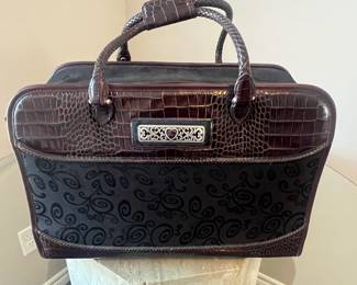 Brighton Weekender, Chocolate Leather and black paisley fabric outside with silver accents, adjustable leather shoulder strap, zippered on all 3 sides, LIKE NEW condition,  19"w x 6" d x 11" h, inside has several pockets & pouches for 3 pairs of shoes, back side has double zippered compartment to slide over pullout out suitcase handle for secure travel, rubber feet on bottom for safety & cleanliness.
