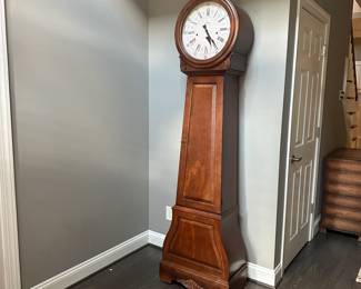 C13 - $300. Howard Miller La Rochelle Grandfather Clock. Model 610-901. Measures 23" at widest point x 13" deep x 7' tall.