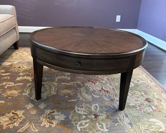 C4 - $250. Bassett Palasides Brindle Round Coffee Table. Measures 36" round x 18" tall. Sunburst veneer pattern using American Walnut. Excellent Condition. 2 drawers.