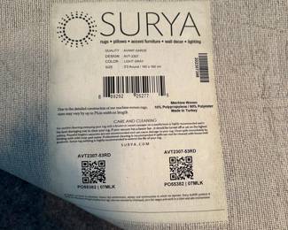 C25 - $65. Surya round area rug 5'3" round. Very good condition and includes rug pad.