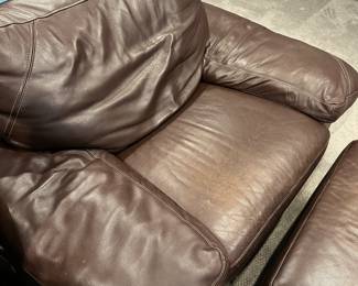 C76 - $350. Dark Brown Leather Chair & Ottoman - Elway Collection by Bassett. Measures 53" wide x 42" deep x 34" tall. Ottoman measures 22" x 29" x 17" tall. In good condition. No holes / rips etc. Super clean. ***Please Note - This item is located on the 3rd floor. Please make sure you arrange for help to get this down and out!