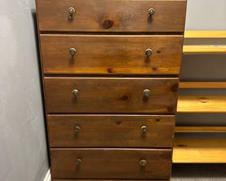 C48 - $40. Small Dresser. Drawers slide. Some knobs need tightened. Body is solid wood. Drawer bases are pressed wood. Measures 26.5" x 15" deep x 41.5" tall.