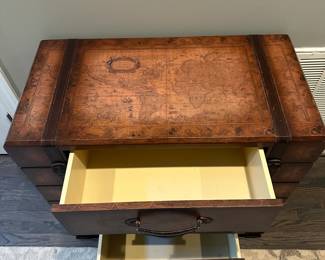C15 - $75. 3 Drawer storage cabinet. Measures 33.5" wide x 17' deep x 31.5" tall. All 3 drawers slide easily. Map design. Has decorative leather straps and handles. Does have wear on corners.