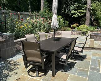 C133 - $300. Outdoor patio set with umbrella & base. 6 rocking chairs. Everything in very good condition.