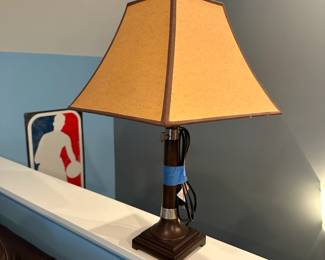 C93 - $15. Single Table Lamp with wooden base silver accents. Measures 24" tall.