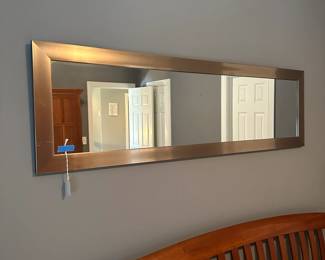 C36 - $25. Mirror with Silver Metal Frame. Measures 54" long x 16" tall.