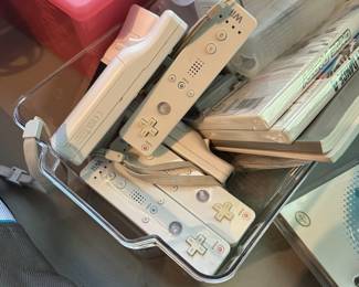 C104 - $225. Wii Bundle. 2 wii systems. Remotes. Games. Guitar. 2 wii fit boards. Untested. Would prefer to sell all together. 6 controllers.