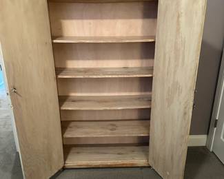 C64 - $150. White Washed Pine Storage Cabinet. Measures 39.5" wide x 12" deep (body) 14.5" deep top lip x 62.5" tall.