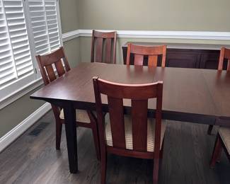 C9 - $550. Ethan Allen Dining Room Table with 8 chairs. Horizons Collection. This photo is with 2 additional leaves in. Measures 42" wide x 70" long x 30.25" tall. Each leaf adds 18" so table extends up to 106". Very good used condition. Shows minor wear I would expect with use. Very sturdy!