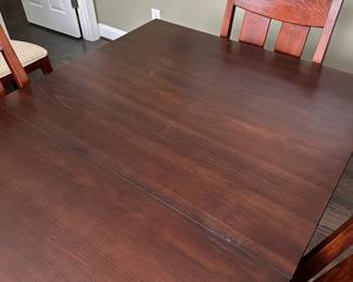 C9 - $550. Ethan Allen Dining Room Table with 8 chairs. Horizons Collection. This photo is with NO leaves in. Measures 42" wide x 70" long x 30.25" tall. Each leaf adds 18" so table extends up to 106". Very good used condition. Shows minor wear I would expect with use. Very sturdy!