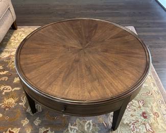 C4 - $250. Bassett Palasides Brindle Round Coffee Table. Measures 36" round x 18" tall. Sunburst veneer pattern using American Walnut. Excellent Condition. 2 drawers.