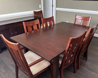 C9 - $550. Ethan Allen Dining Room Table with 8 chairs. Horizons Collection. This photo is with NO leaves in. Measures 42" wide x 70" long x 30.25" tall. Each leaf adds 18" so table extends up to 106". Very good used condition. Shows minor wear I would expect with use. Very sturdy!
